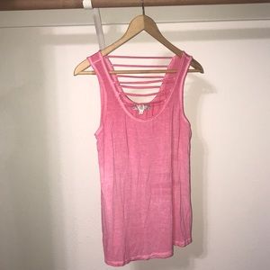 pink u neck with decorative straps.